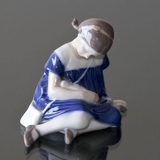 Girl with Doll sitting on her side, Bing & Grondahl figurine no. 1526 or 400