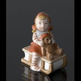 Pixie on Sleigh with a teddy bear, Royal Copenhagen Christmas figurine no. 764