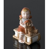 Pixie on Sleigh with a teddy bear, Royal Copenhagen Christmas figurine no. 764