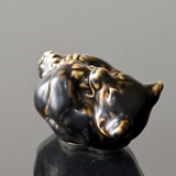 Bear Cub lying down bitting its foot, Royal Copenhagen stoneware figurine no. 21434 or 234