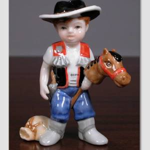 Thomas, Cowboy dreng. Figur i Royal Copenhagens serie af minibørn | Nr. 1249011 | Alt. 1249011 | DPH Trading