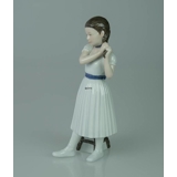 Ballerina standing doing her hair, Royal Copenhagen figurine no. 138