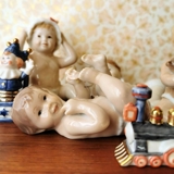 Babbling baby lying on back, Royal Copenhagen figure no. 244