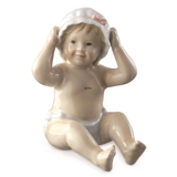 Sitzendes Baby mit einer Badekappe/Haube, Royal Copenhagen Figur Nr. 247