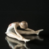 Siddende ballerina som bøjer sig forover, Royal Copenhagen figur nr. 329