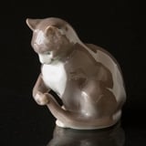 Sitting Cat playing with its tail, Bing & Grondahl figurine No. 1553