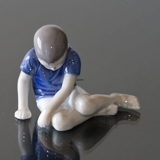 Boy sitting sadly looking at the ground, Bing & Grondahl figurine No. 1671