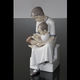 Mother with child taking off sock, Bing & Grondahl figurine no. 1829