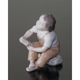 Please help, Mummy, boy sitting with shoe - with brown trousers, Bing & Grondahl figurine No. 2275