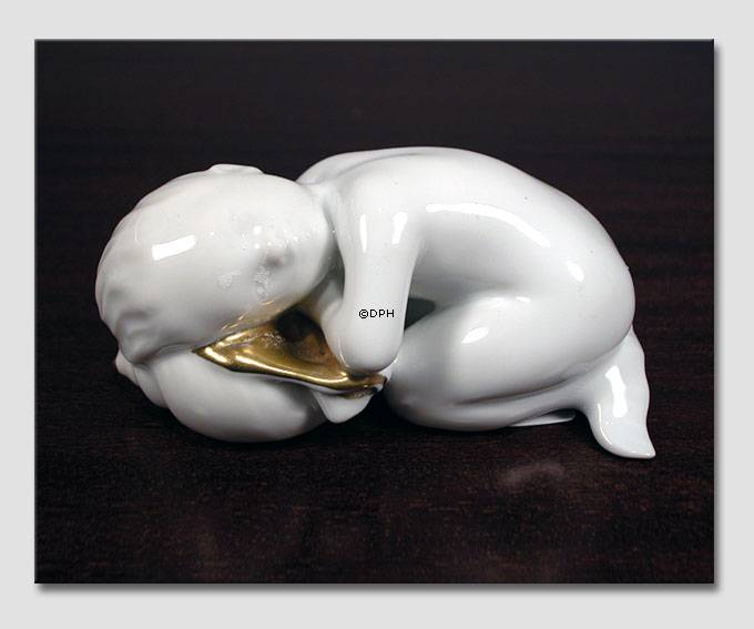 Havdreng hvilende, dekoreret med guld, Bing & Grøndahl figur nr. 2315