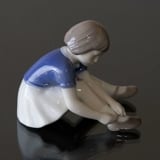 Girl Buttoning her Shoe, Bing & Grondahl figurine no. 2317