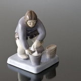 Greenlandish woman with bucket pouring water in, Bing & Grondahl figurine No. 2416