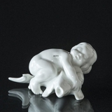 Boy lying on fish, Bing & Grondahl figurine no, 35 or 4035