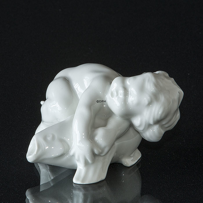 Dreng liggende på fisk, Bing & Grøndahl figur nr 35 eller 4035