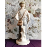 Figure of fisherman with fish and fishing rod, marked GDR 22