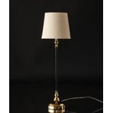 Golden and black lamp with round shade