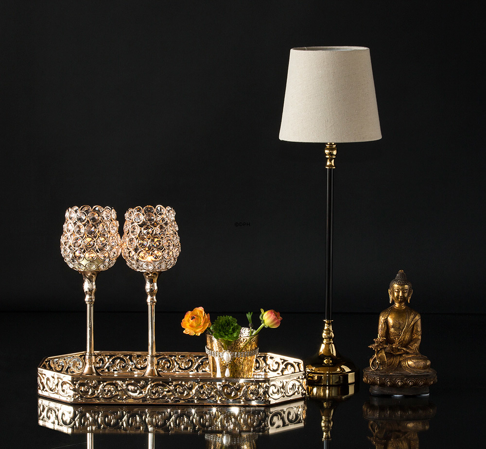 Bordlampe i gylden og sort med rund skærm