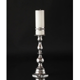 Candlestick in aluminium with round shapes.