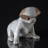 Pekinese dog sitting down, Royal Copenhagen dog figurine No. 1453