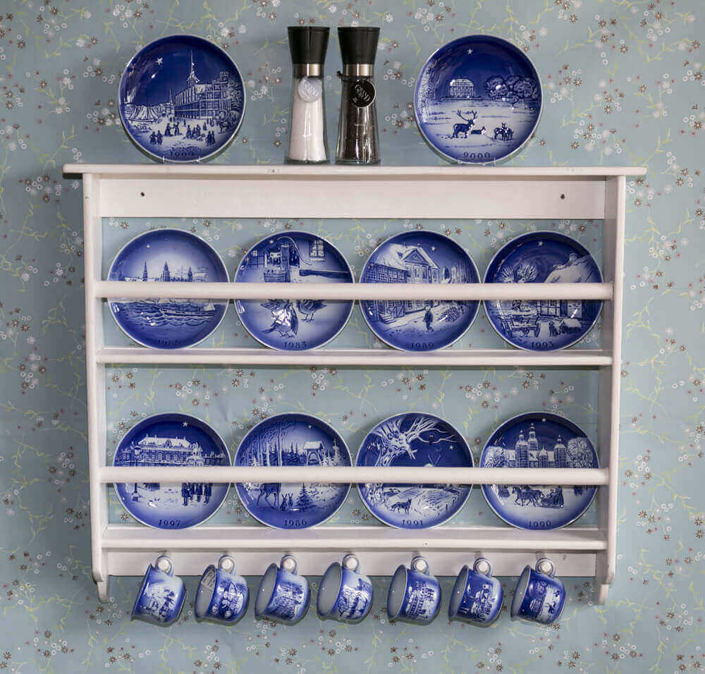 Hans Christian Andersen Plates in a white plate rack