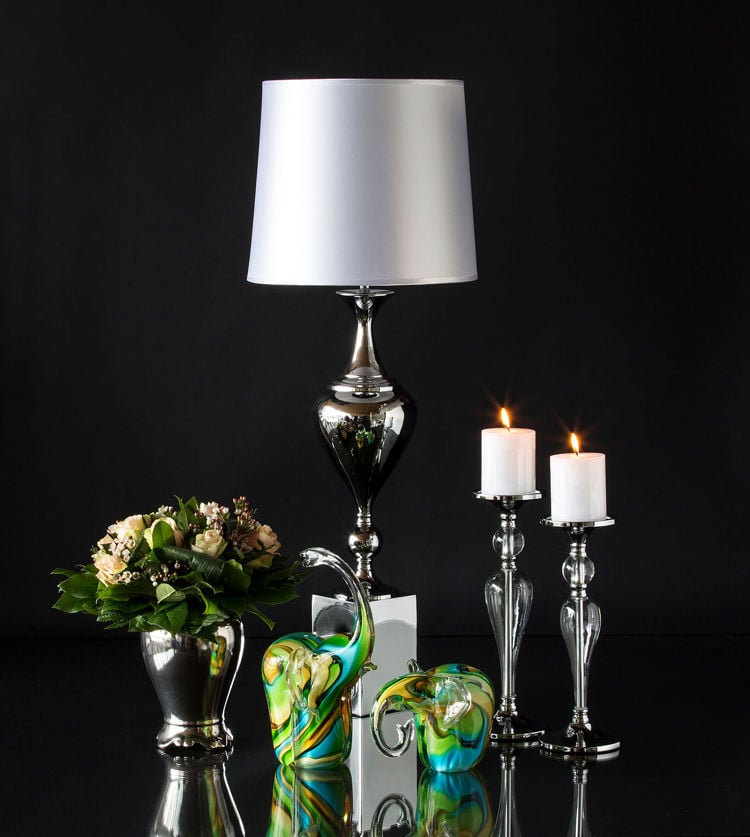 Colorful elephants in glass with lamp, candlesticks and metal flower pot