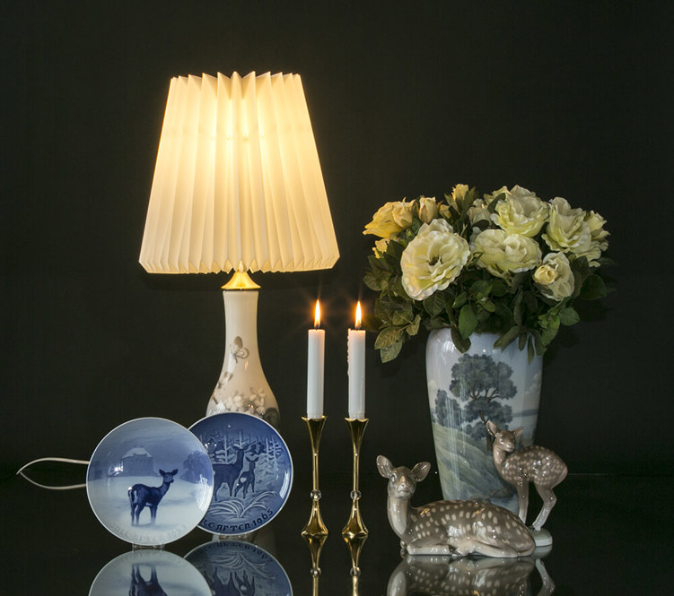 Christmas plates and figurines with deer together with landscape vase