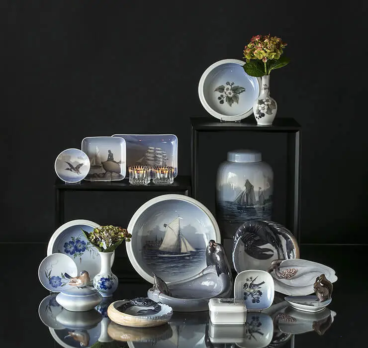 Porcelain vases and bowls with flowers and maritime motifs