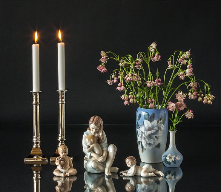 Royal Copenhagen children figurines and vases together with metal candlesticks